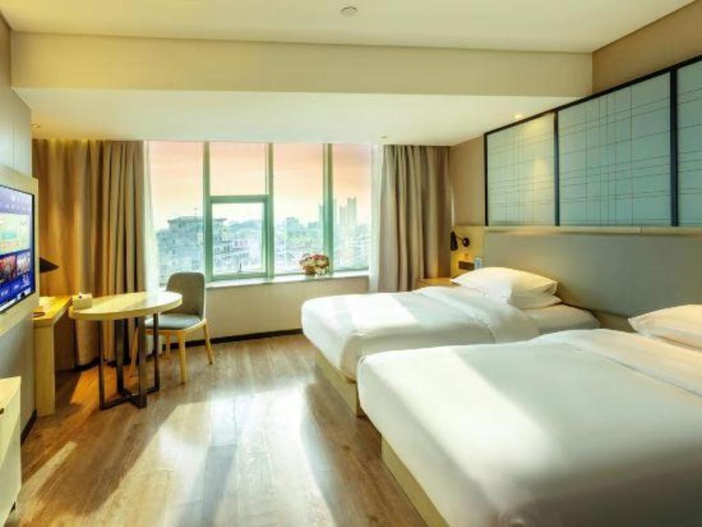 Echarm Hotel Yangjiang Baili Plaza Exterior photo